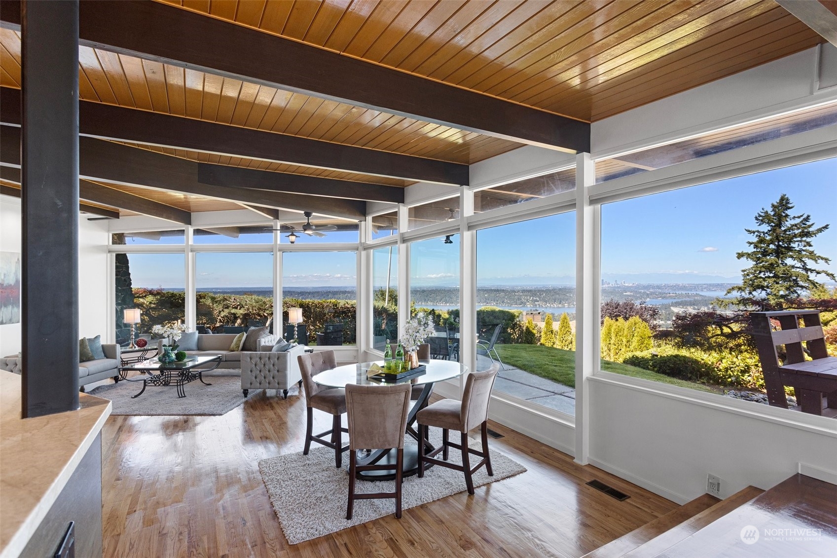 4428 140th Avenue Southeast Bellevue, WA 98006 - Photo 16 of 40 a view of a dining room with furniture window and outside view
