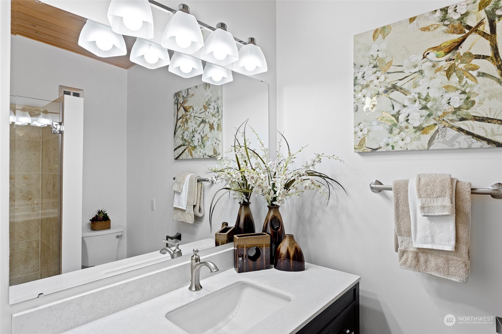 4428 140th Avenue Southeast Bellevue, WA 98006 - Photo 29 of 40 a bathroom with a sink vanity and a mirror