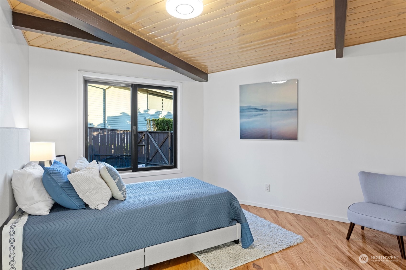 4428 140th Avenue Southeast Bellevue, WA 98006 - Photo 31 of 40 a bedroom with a bed and wooden floor