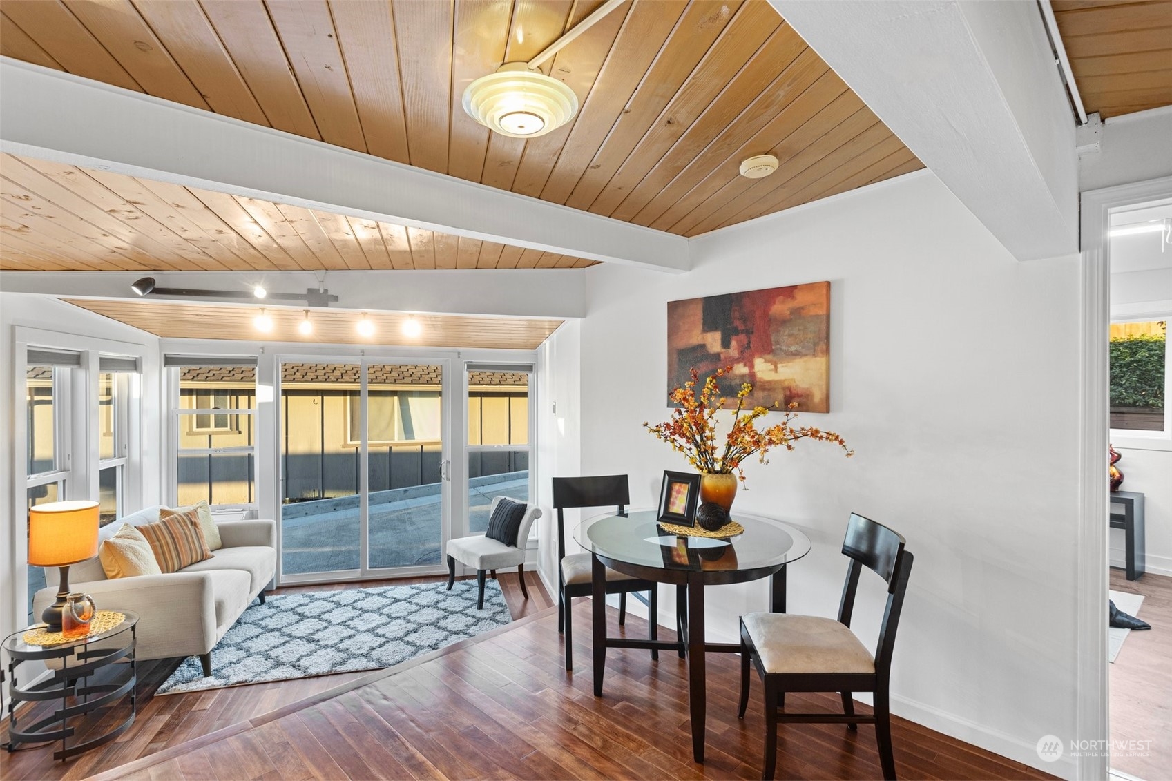 4428 140th Avenue Southeast Bellevue, WA 98006 - Photo 33 of 40 a dining room with furniture and wooden floor