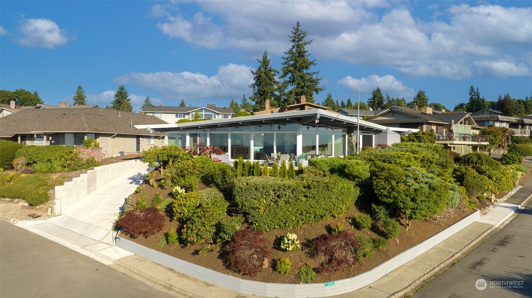 4428 140th Avenue Southeast Bellevue, WA 98006 - Photo 6 of 40 a view of a house with a yard and potted plants