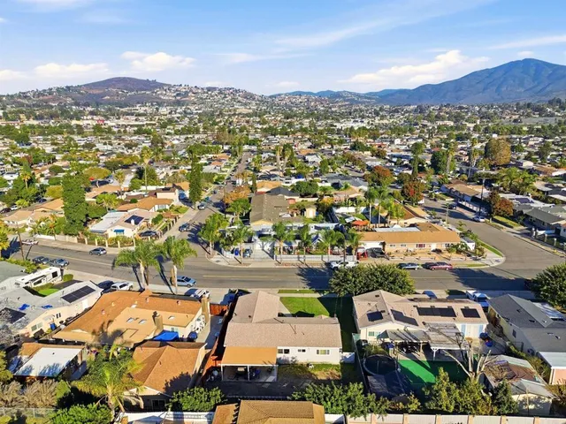 an aerial view of residential houses with outdoor space