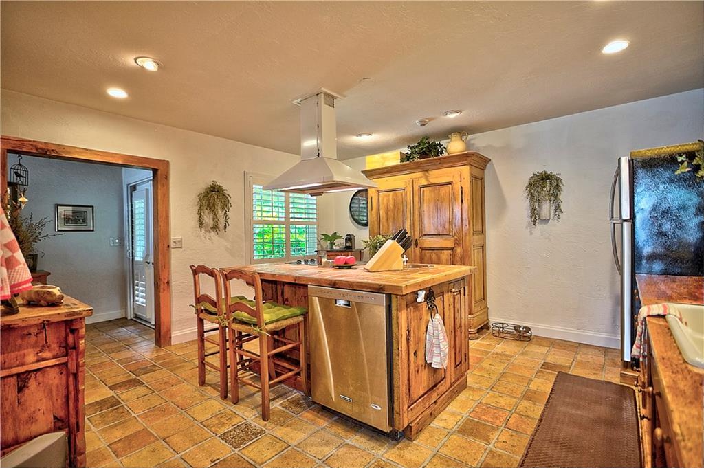 1003 Southeast Riverside Drive Stuart, FL 34996 - Photo 5 of 31 a view of a kitchen and dining area