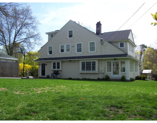 5 Ravenscroft Road Winchester, MA 01890 - Photo 25 of 26 a front view of a house with a garden