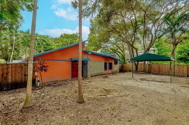 a house with trees in front of it