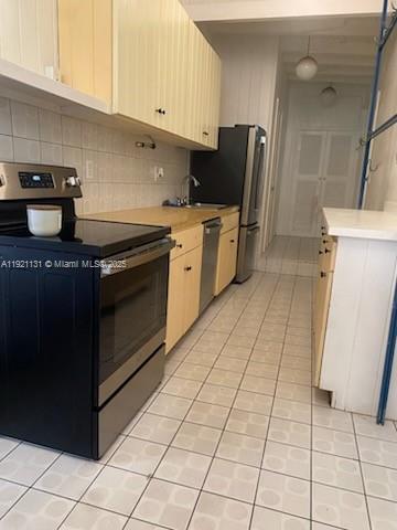 3656 Avocado Avenue Miami, FL 33133 - Photo 11 of 21 a kitchen with granite countertop a stove a sink and a refrigerator