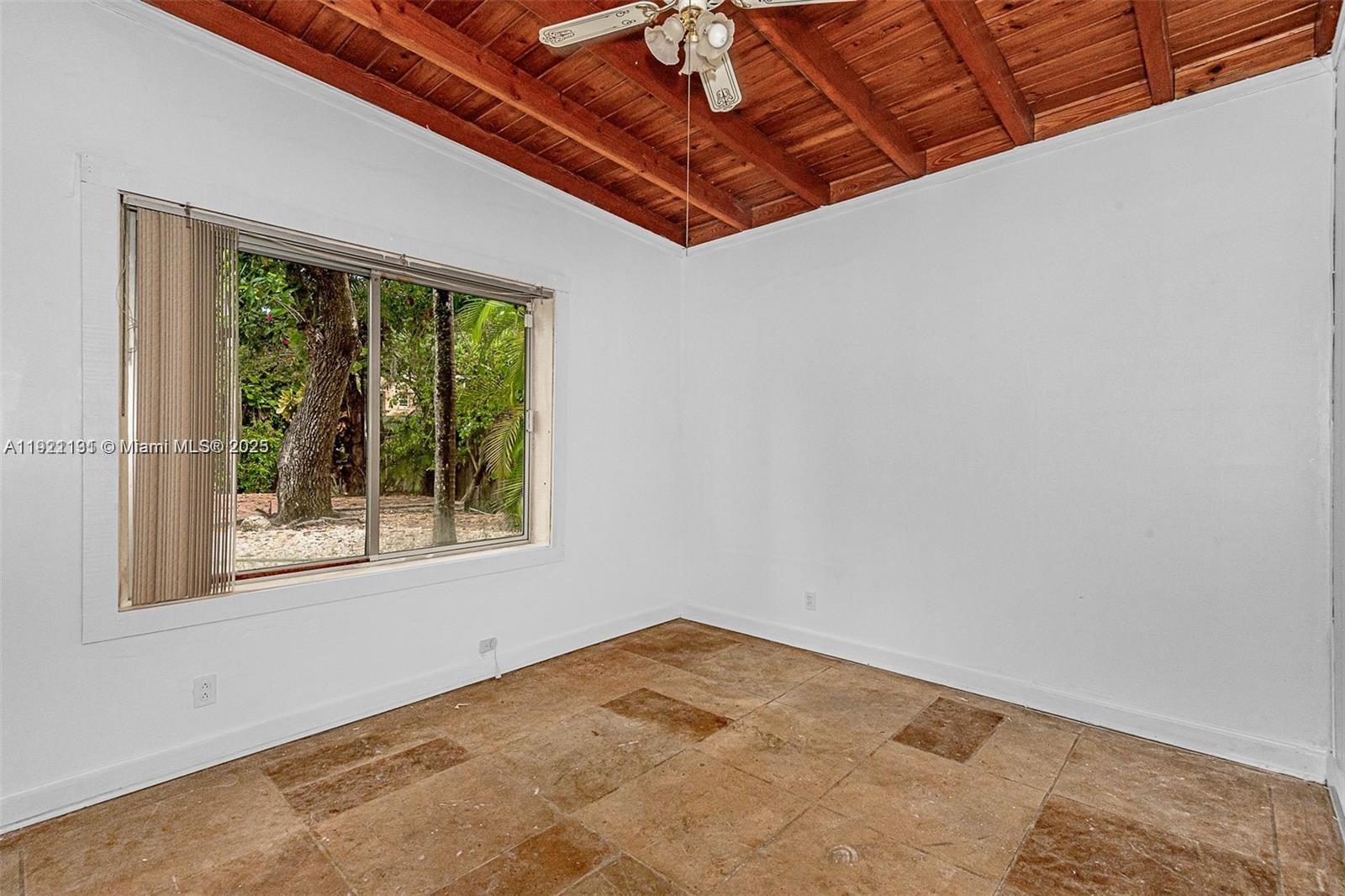 3656 Avocado Avenue Miami, FL 33133 - Photo 13 of 21 a view of a room with a large window