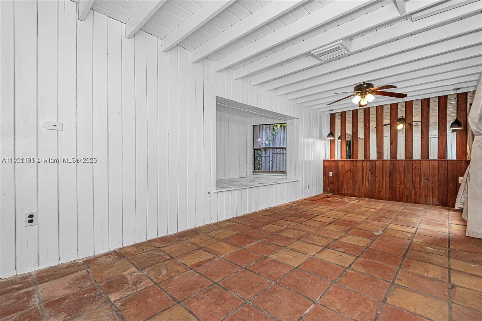 3656 Avocado Avenue Miami, FL 33133 - Photo 17 of 21 a bedroom with a large bed and a window