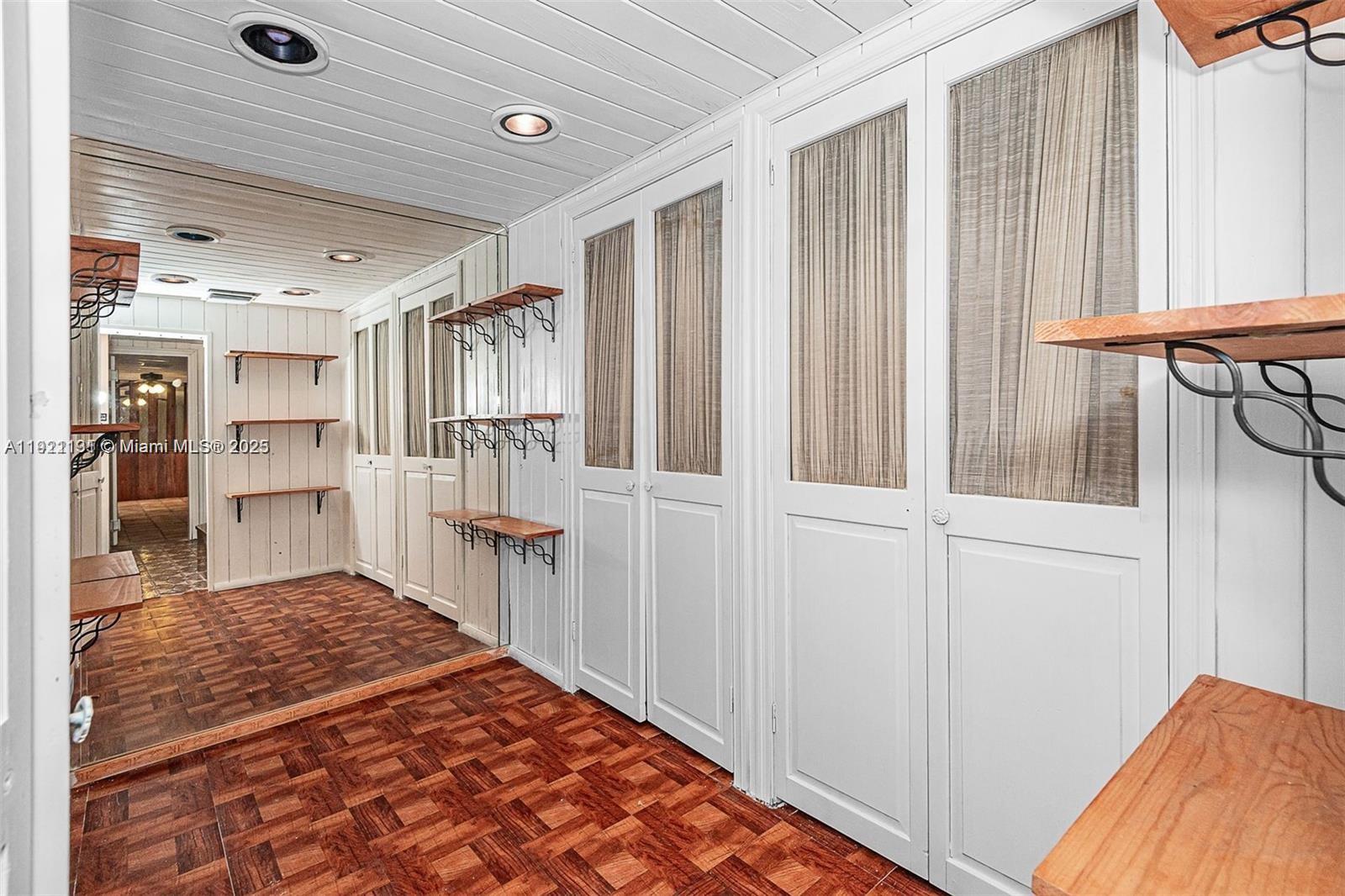 3656 Avocado Avenue Miami, FL 33133 - Photo 19 of 21 a bedroom with a bed and a cabinets