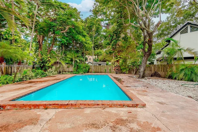 a view of outdoor space with swimming pool