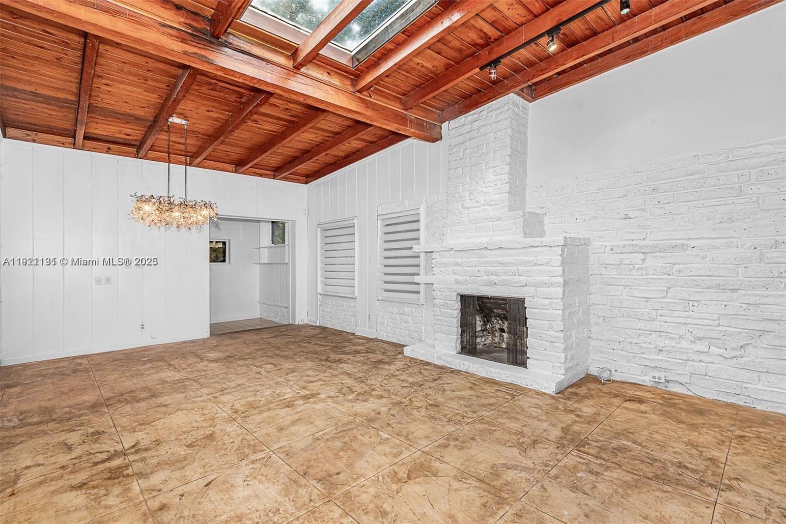 3656 Avocado Avenue Miami, FL 33133 - Photo 5 of 21 a view of empty room with a fireplace