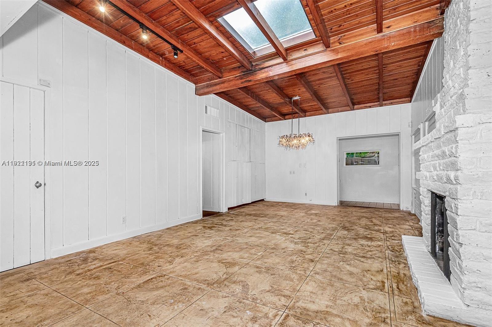 3656 Avocado Avenue Miami, FL 33133 - Photo 6 of 21 a view of a livingroom with a fireplace