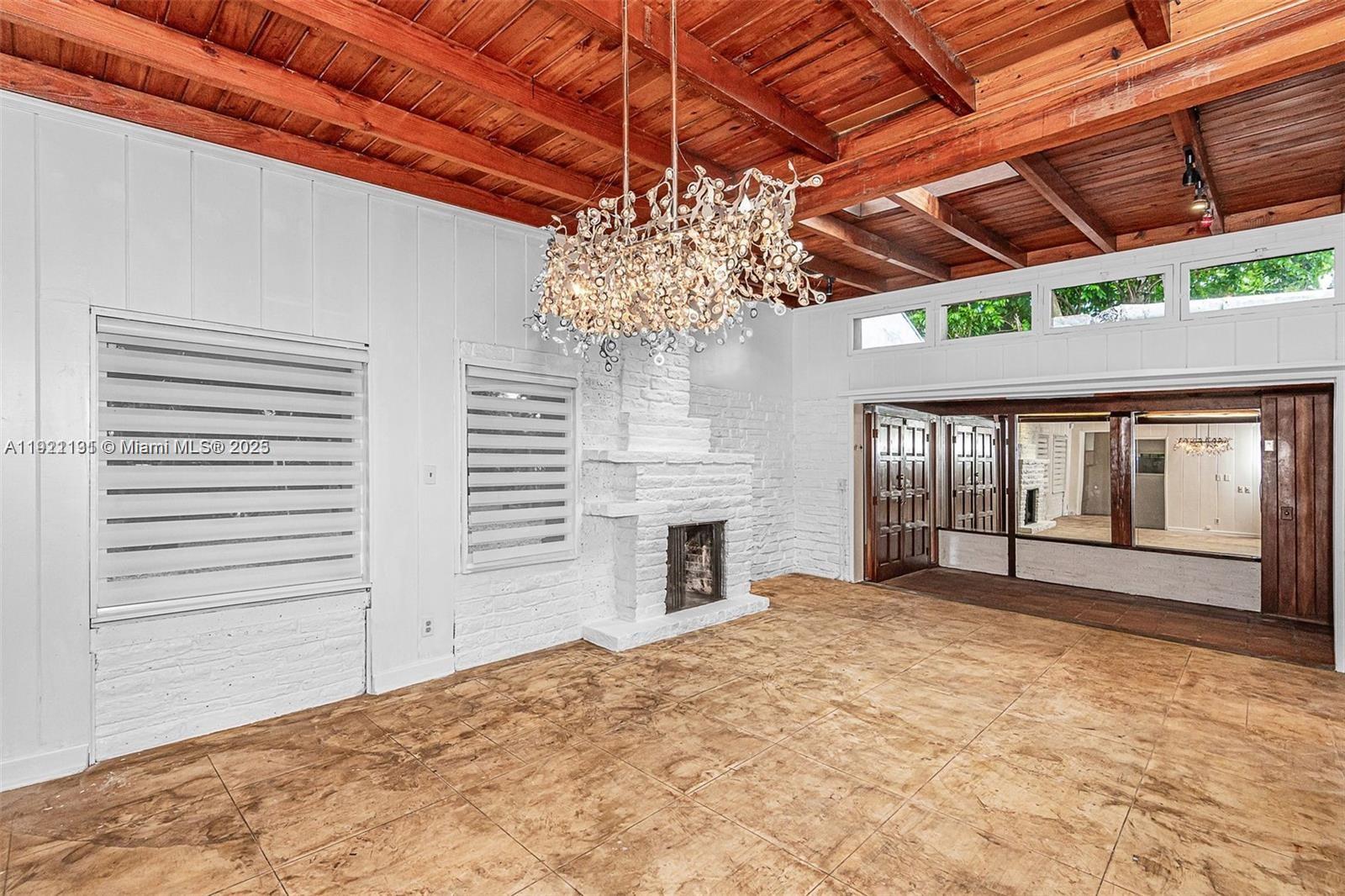 3656 Avocado Avenue Miami, FL 33133 - Photo 7 of 21 a bedroom with bed and a large window