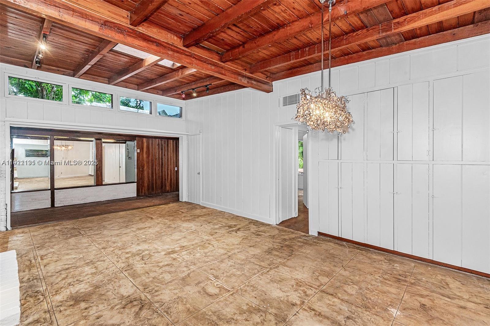 3656 Avocado Avenue Miami, FL 33133 - Photo 8 of 21 a view of an empty room with a window