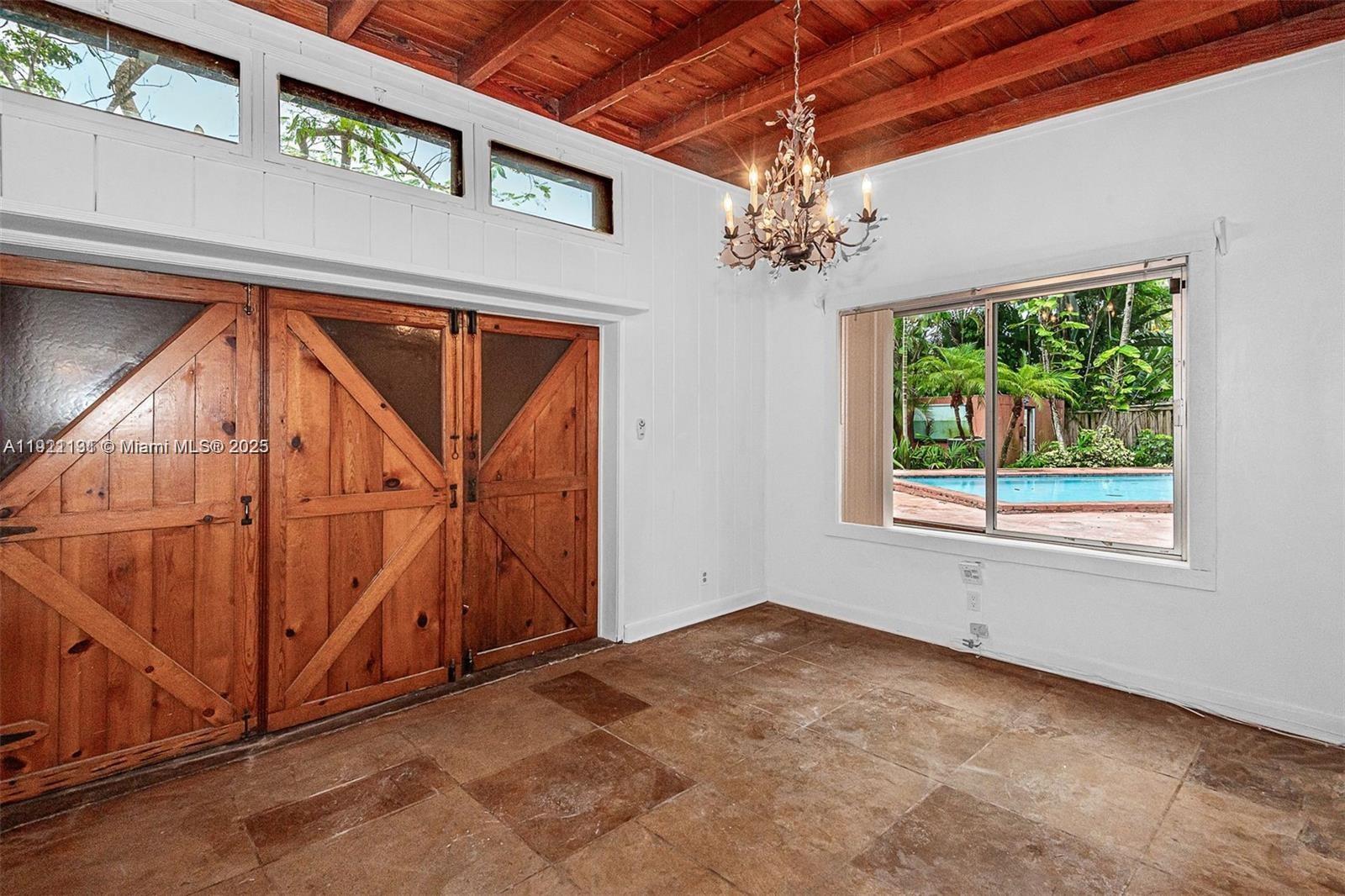 3656 Avocado Avenue Miami, FL 33133 - Photo 10 of 21 a view of a livingroom with a staircase