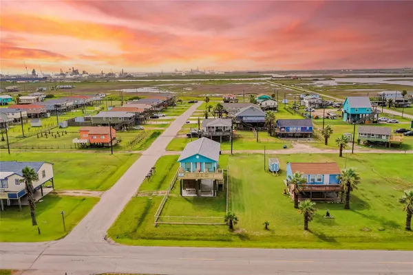 a view of a swimming pool with a table and chairs