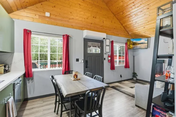 a kitchen with stainless steel appliances a stove microwave and a refrigerator