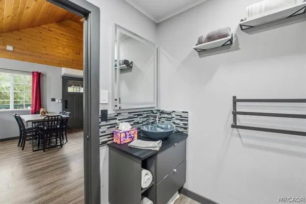 a bedroom with a bed and a night stand