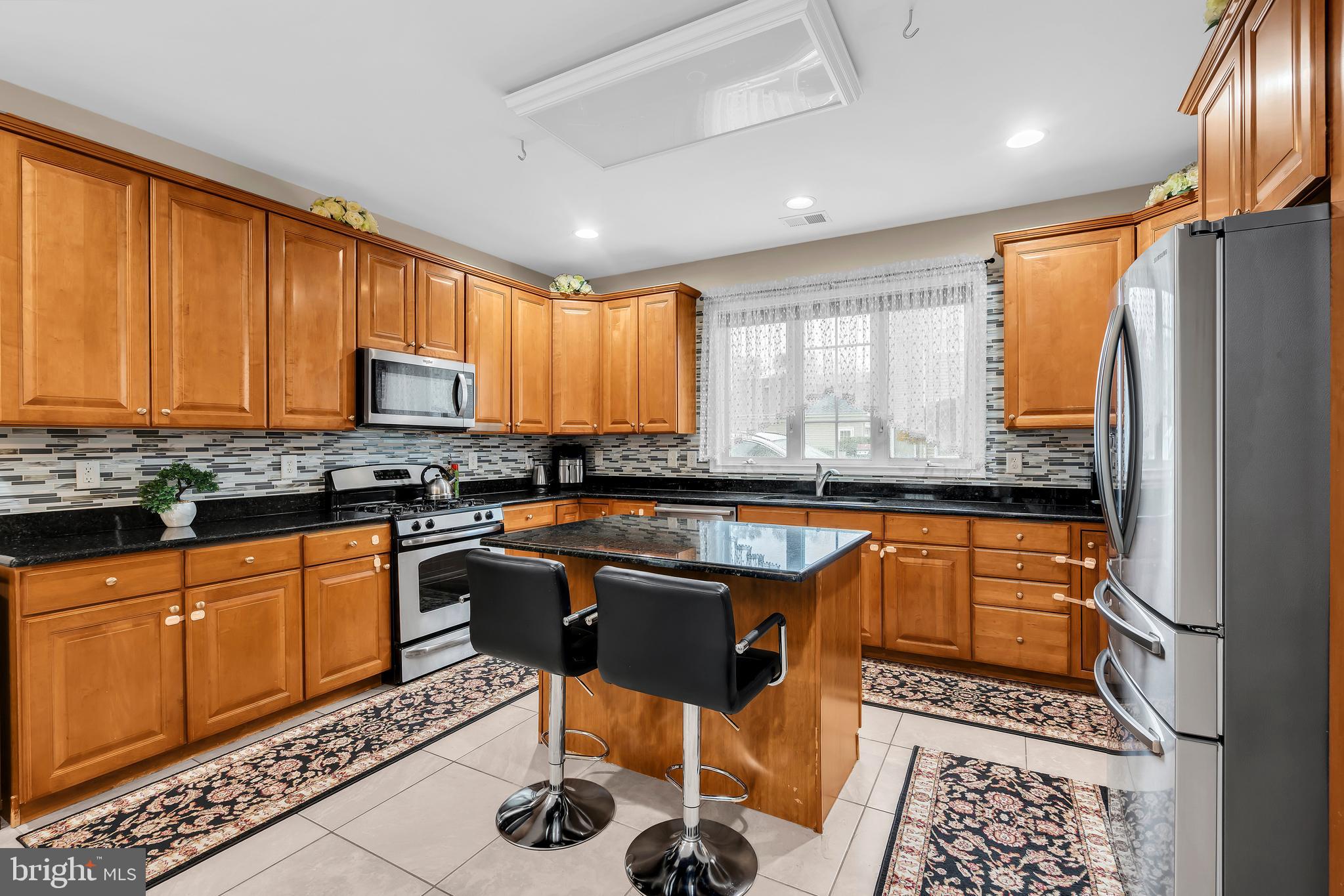 20 Jockey Place Chesterfield, NJ 08515 - Photo 18 of 49 a kitchen with stainless steel appliances granite countertop a stove a sink dishwasher a refrigerator and cabinets with wooden floor