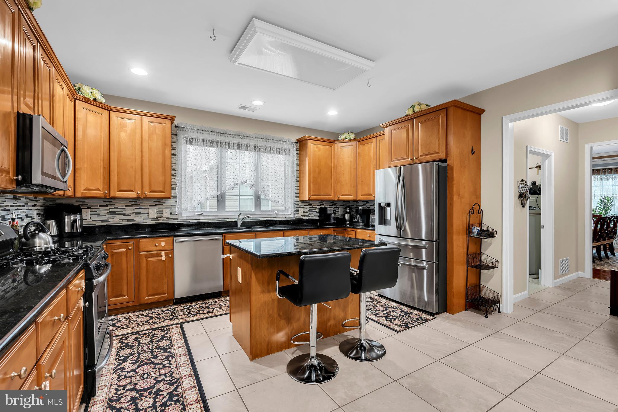 20 Jockey Place Chesterfield, NJ 08515 - Photo 19 of 49 a kitchen with stainless steel appliances granite countertop a stove a sink a refrigerator and island
