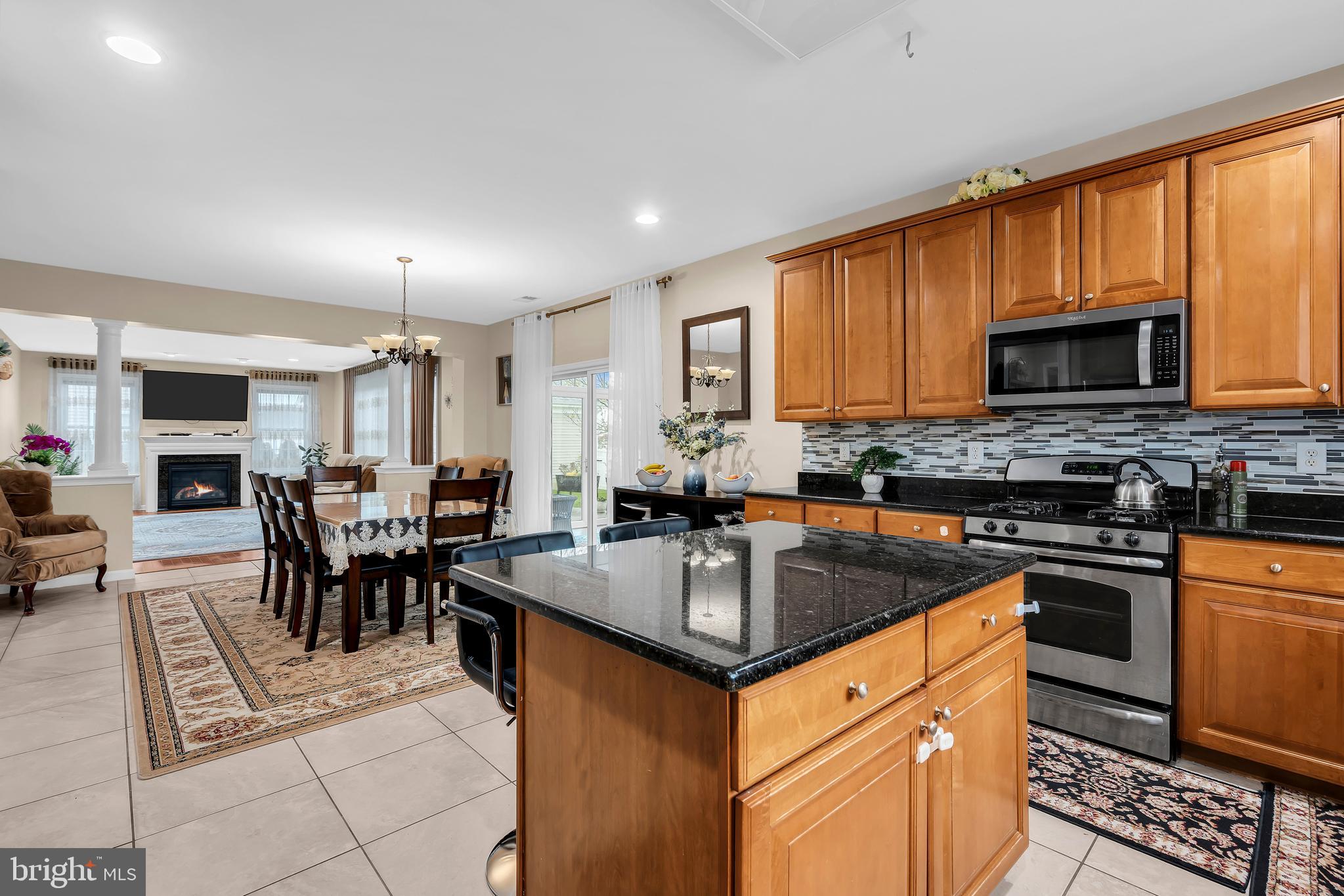 20 Jockey Place Chesterfield, NJ 08515 - Photo 20 of 49 a kitchen with stainless steel appliances granite countertop a stove a sink a microwave and a refrigerator