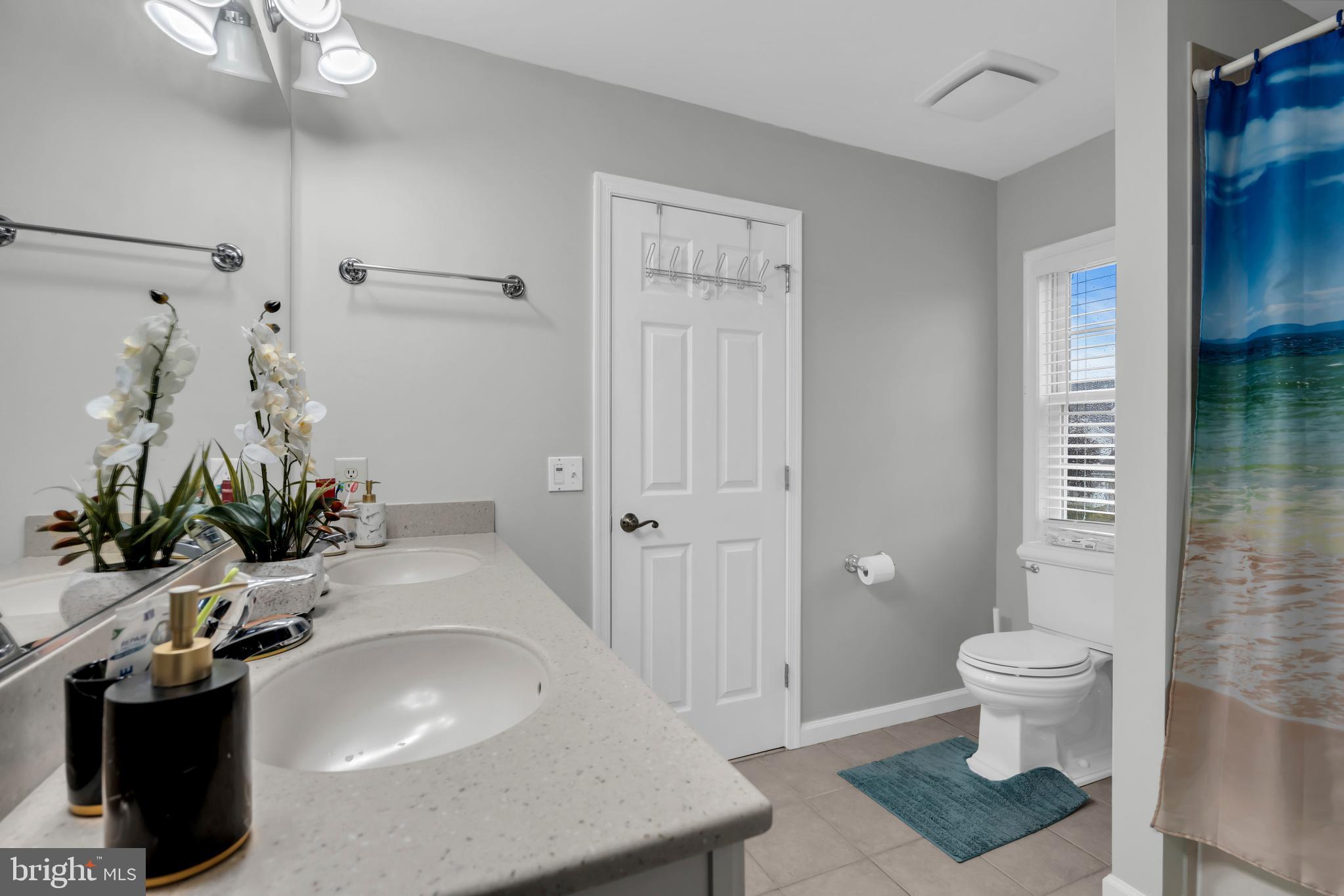 20 Jockey Place Chesterfield, NJ 08515 - Photo 32 of 49 a bathroom with a sink a toilet and shower curtain