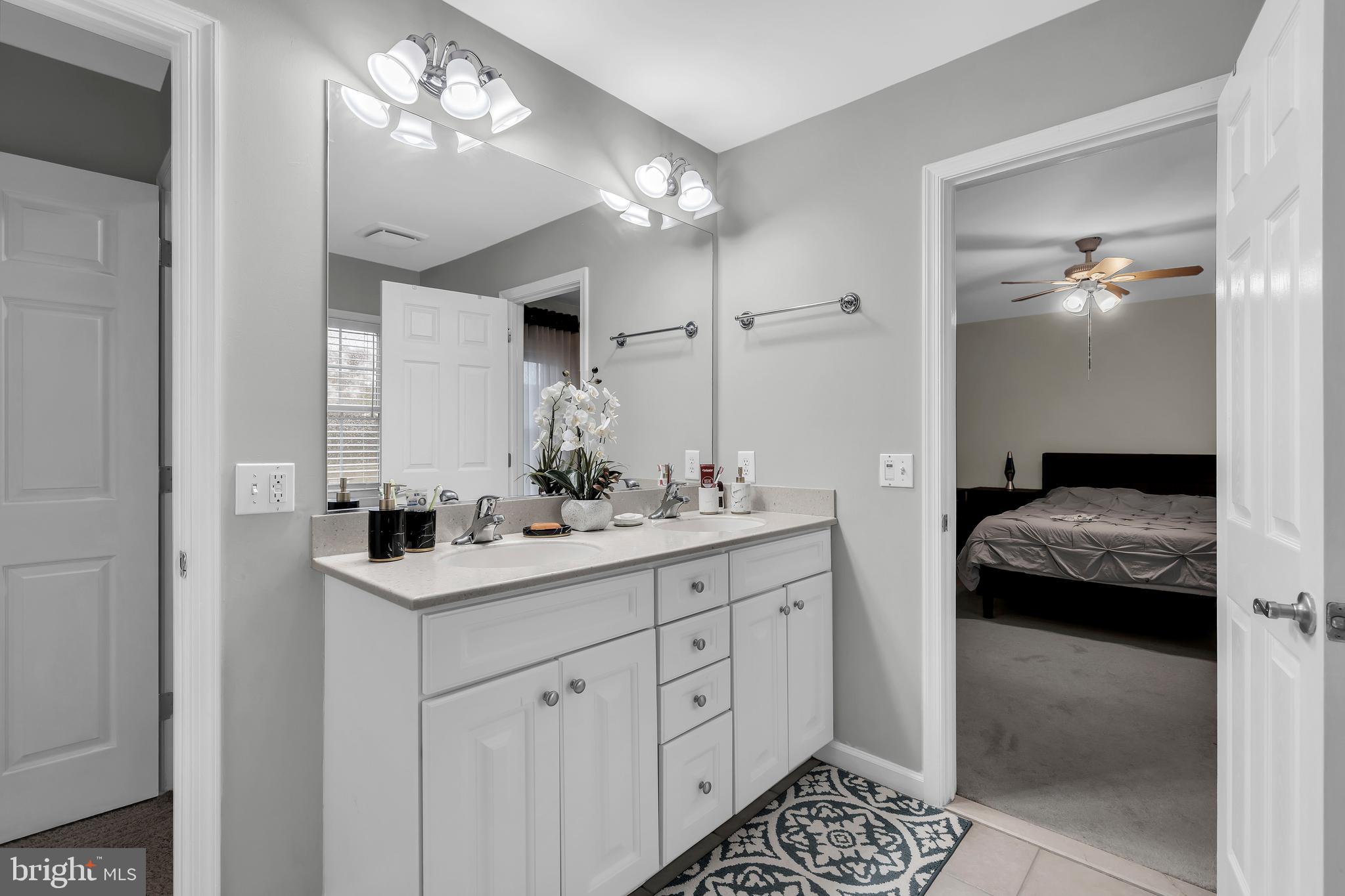20 Jockey Place Chesterfield, NJ 08515 - Photo 33 of 49 a en suite bathroom with a double sink and mirror