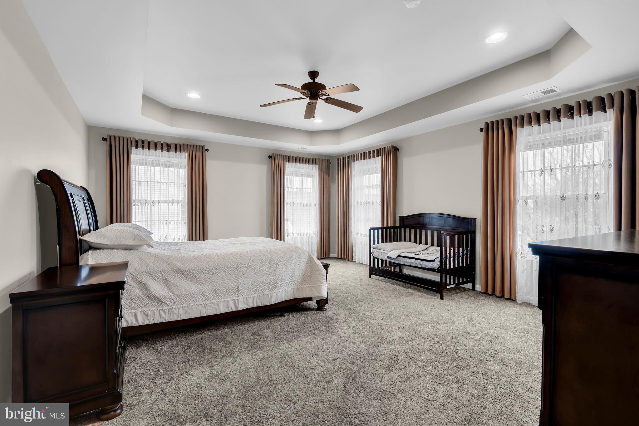 20 Jockey Place Chesterfield, NJ 08515 - Photo 37 of 49 a bedroom with a bed a couch and dresser