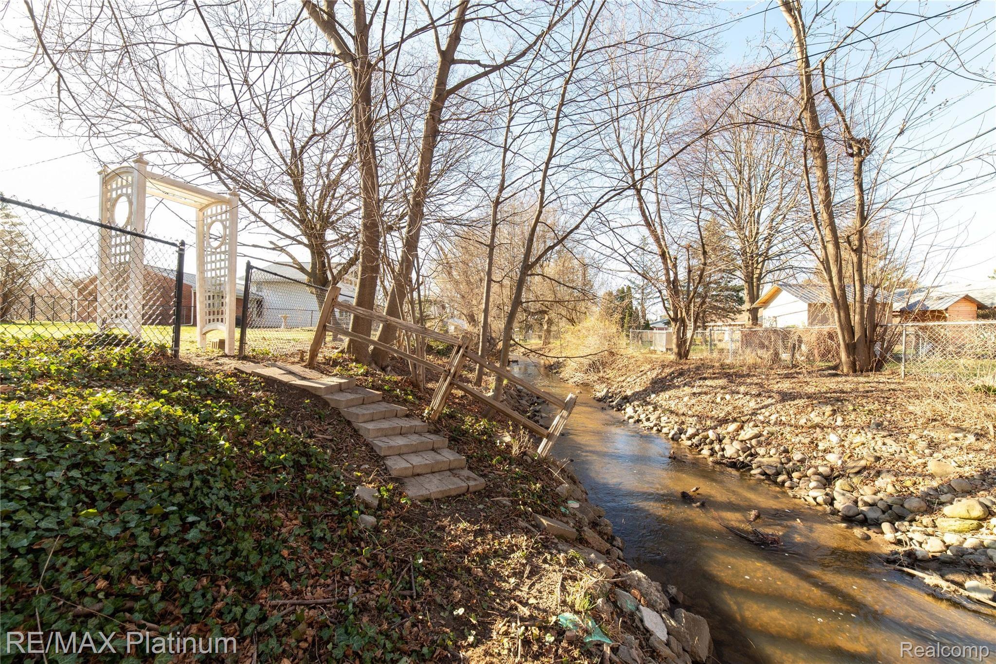 23857 Ripple Creek Novi, MI 48375 - Photo 25 of 28 Nature just beyond the fenceline