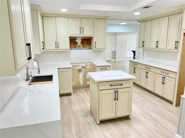 a view of a dining room with furniture and a potted plant