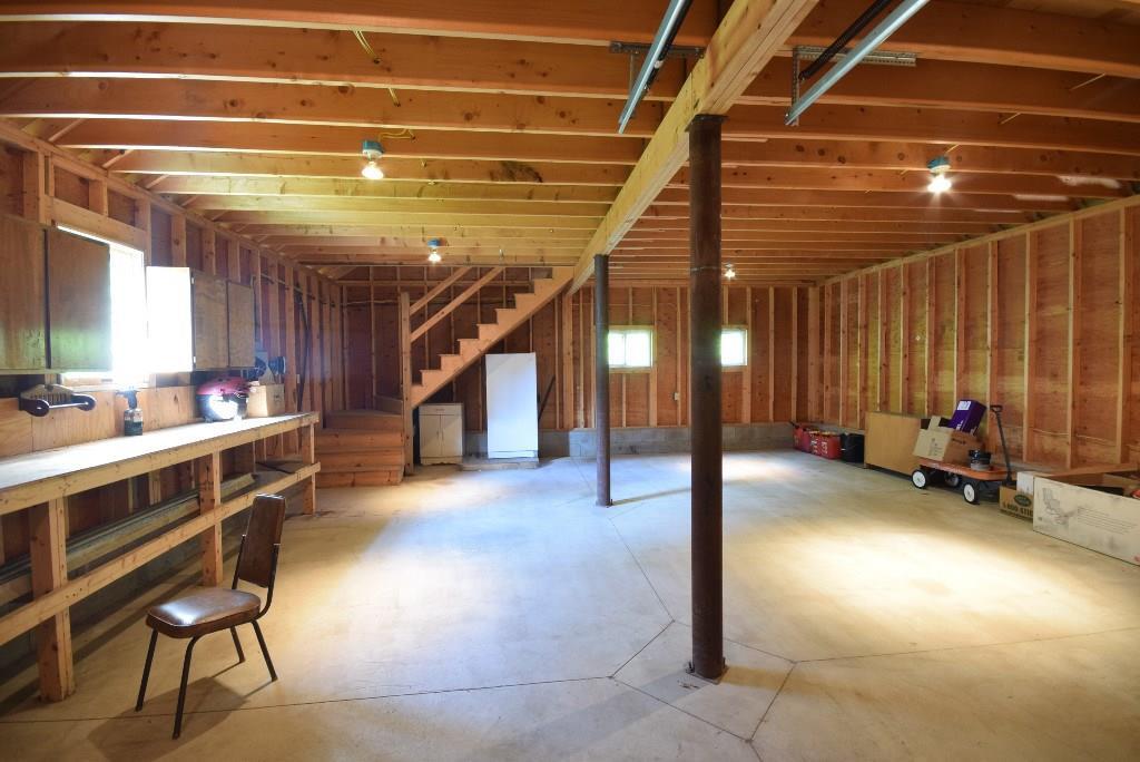 480 Bunker Hill Road Lagrange, ME 04453 - Photo 18 of 23 Garage interior with built-in workbench