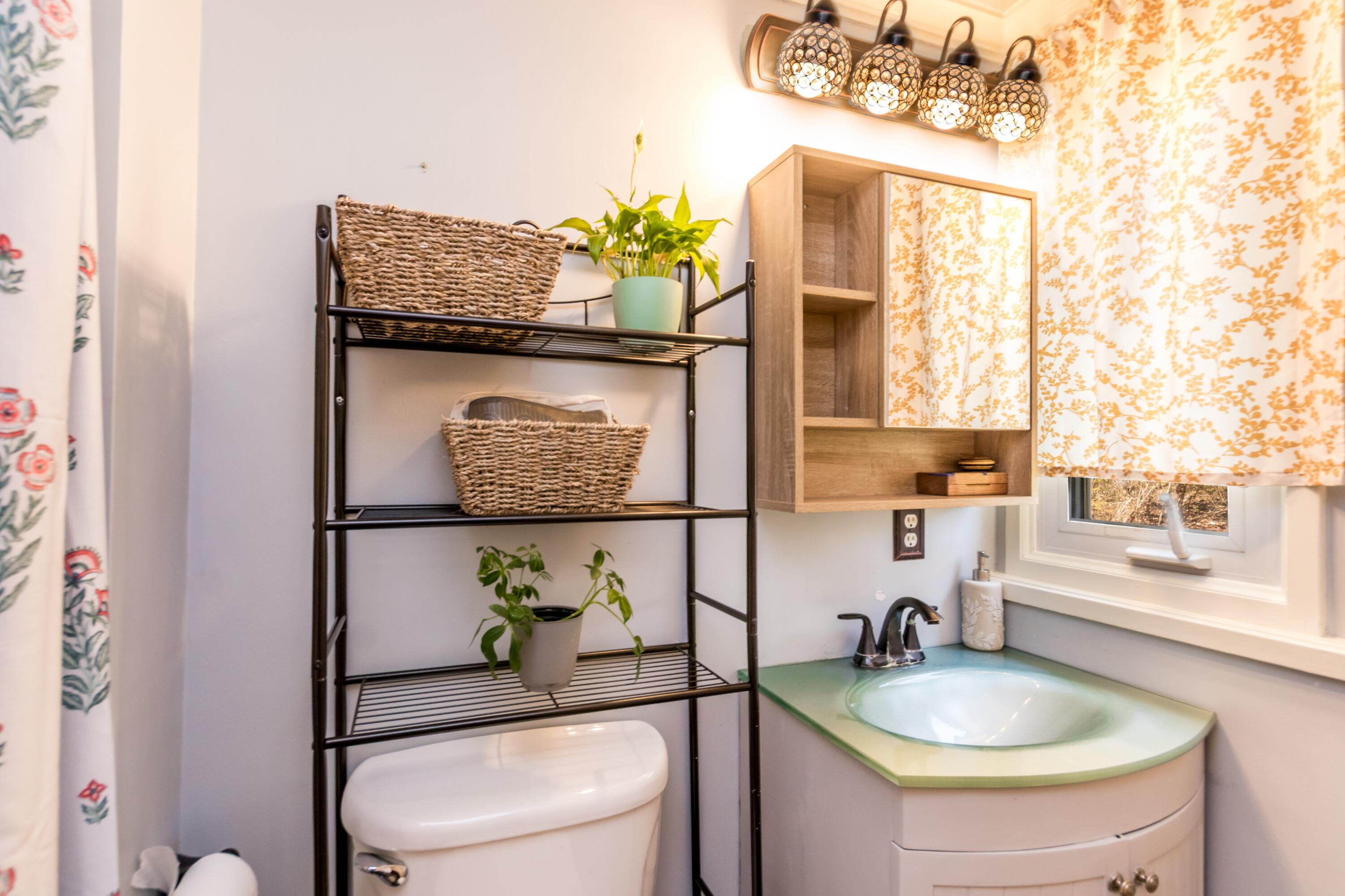 149 Wheeler Road Mashpee, MA 02649 - Photo 18 of 41 a bathroom with a granite countertop sink a toilet and mirror
