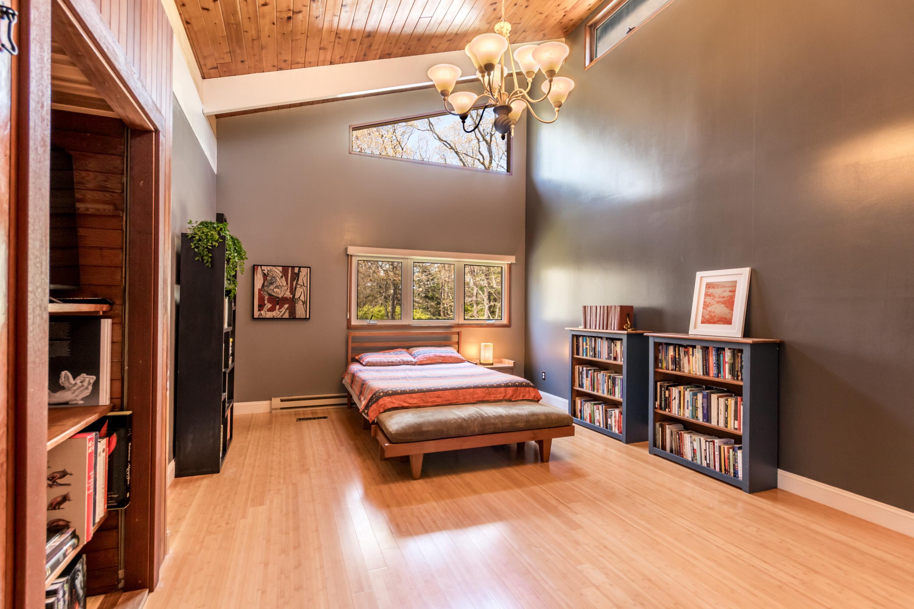 149 Wheeler Road Mashpee, MA 02649 - Photo 21 of 41 a bedroom with furniture and a book shelf