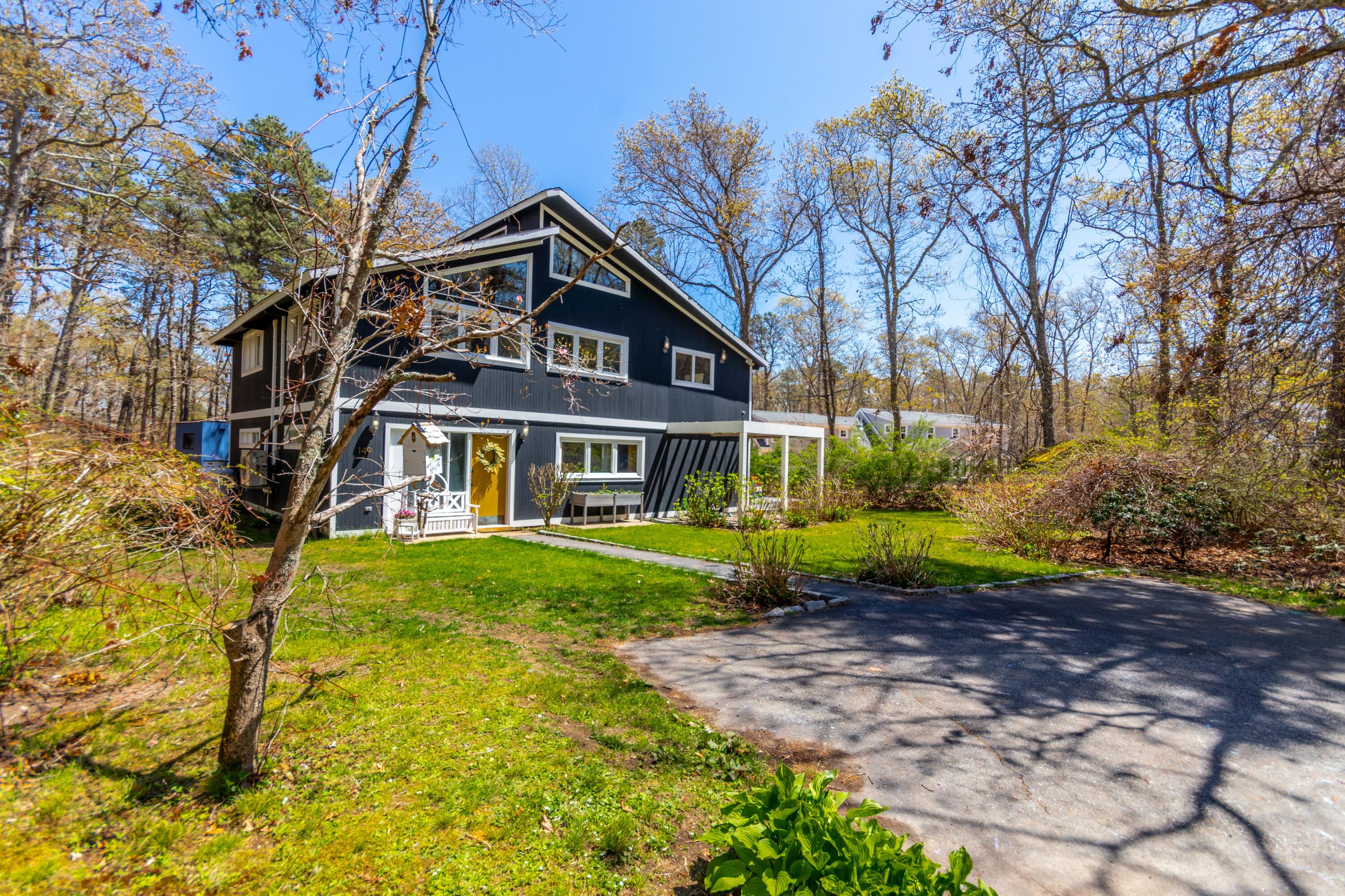 149 Wheeler Road Mashpee, MA 02649 - Photo 33 of 41 a front view of a house with a yard