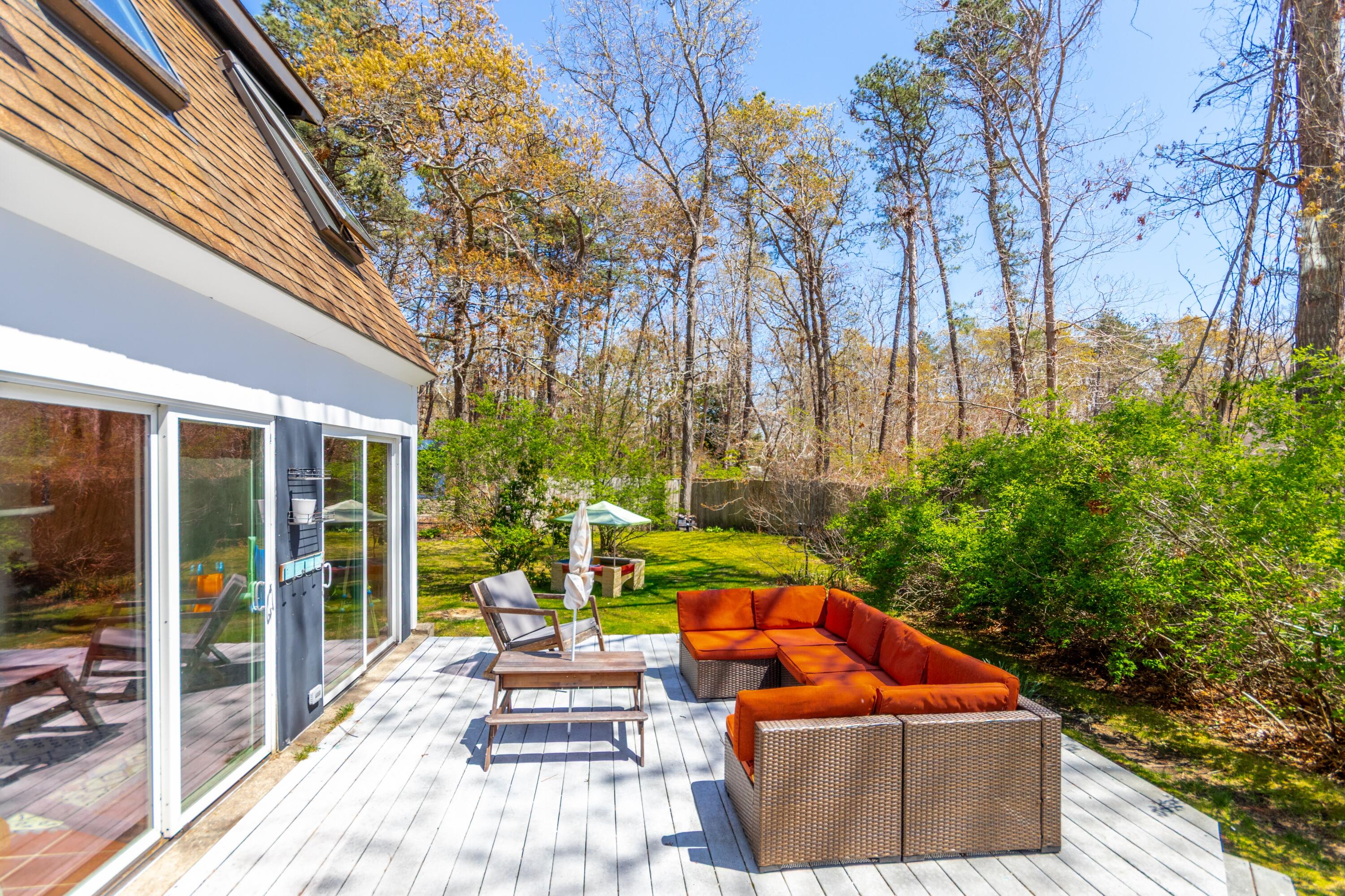 149 Wheeler Road Mashpee, MA 02649 - Photo 34 of 41 Deck and yard
