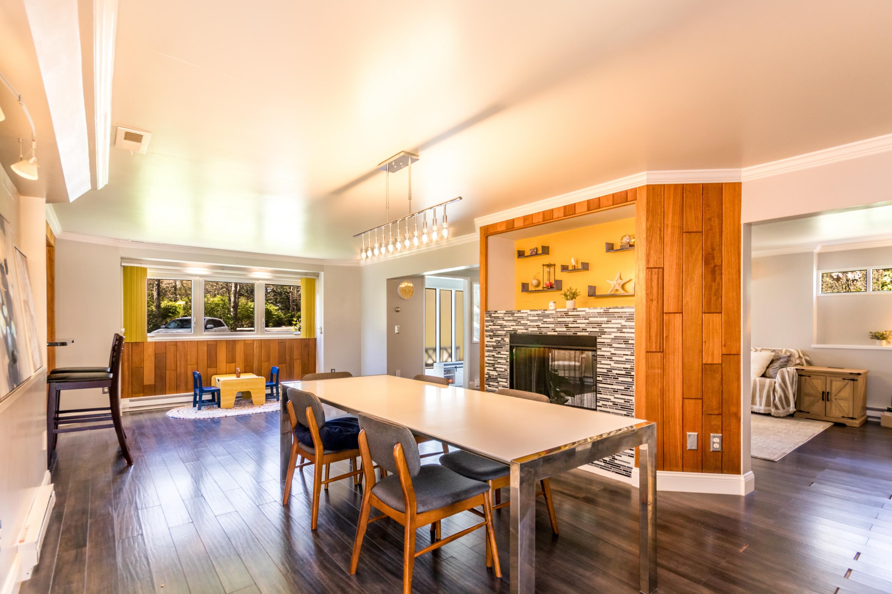 149 Wheeler Road Mashpee, MA 02649 - Photo 8 of 41 a view of a dining room with furniture window and wooden floor