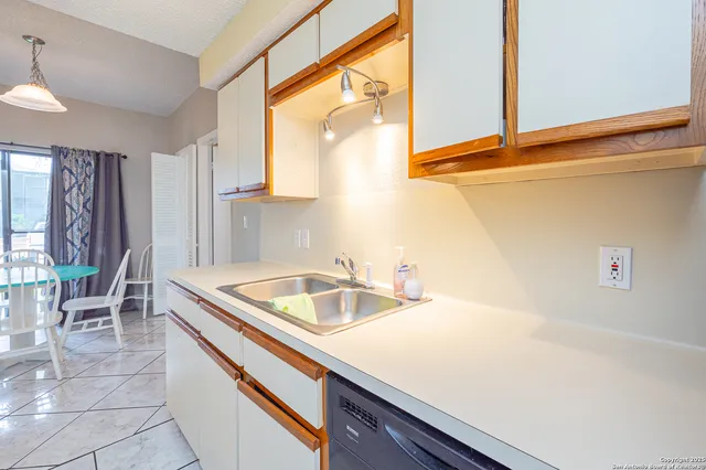 a kitchen with a sink and a window
