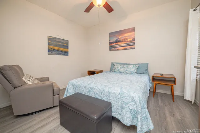 a bedroom with a bed and a couch