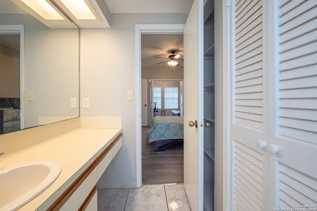 a bathroom with a tub and shower