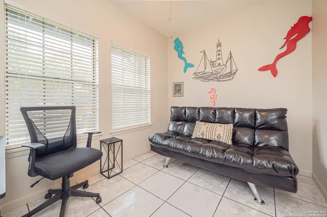 a living room with furniture and a window