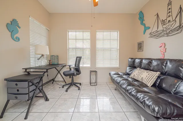 a living room with furniture and a window