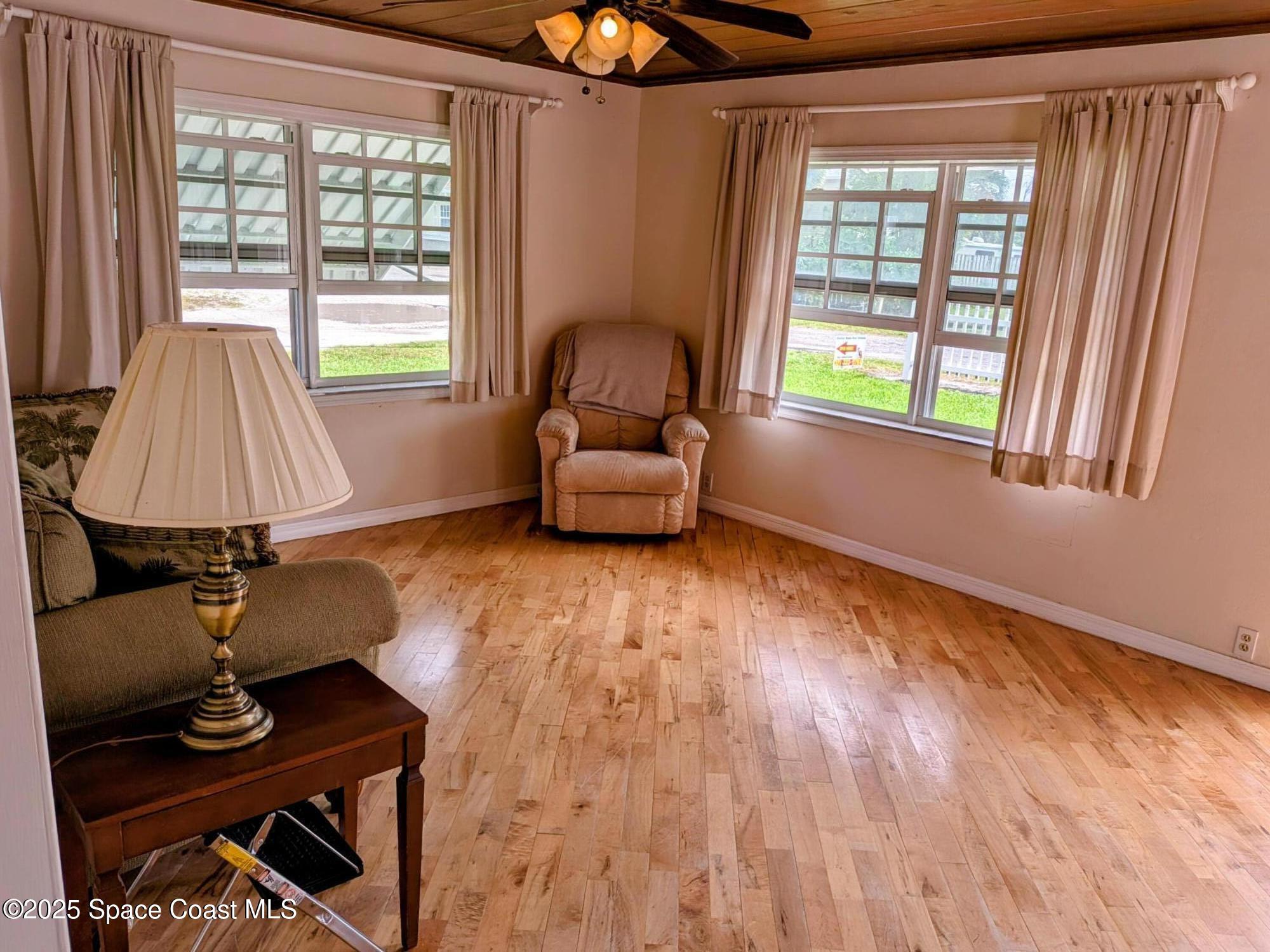 2767 Palm Drive Palm Bay, FL 32905 - Photo 15 of 26 a room with furniture and a window