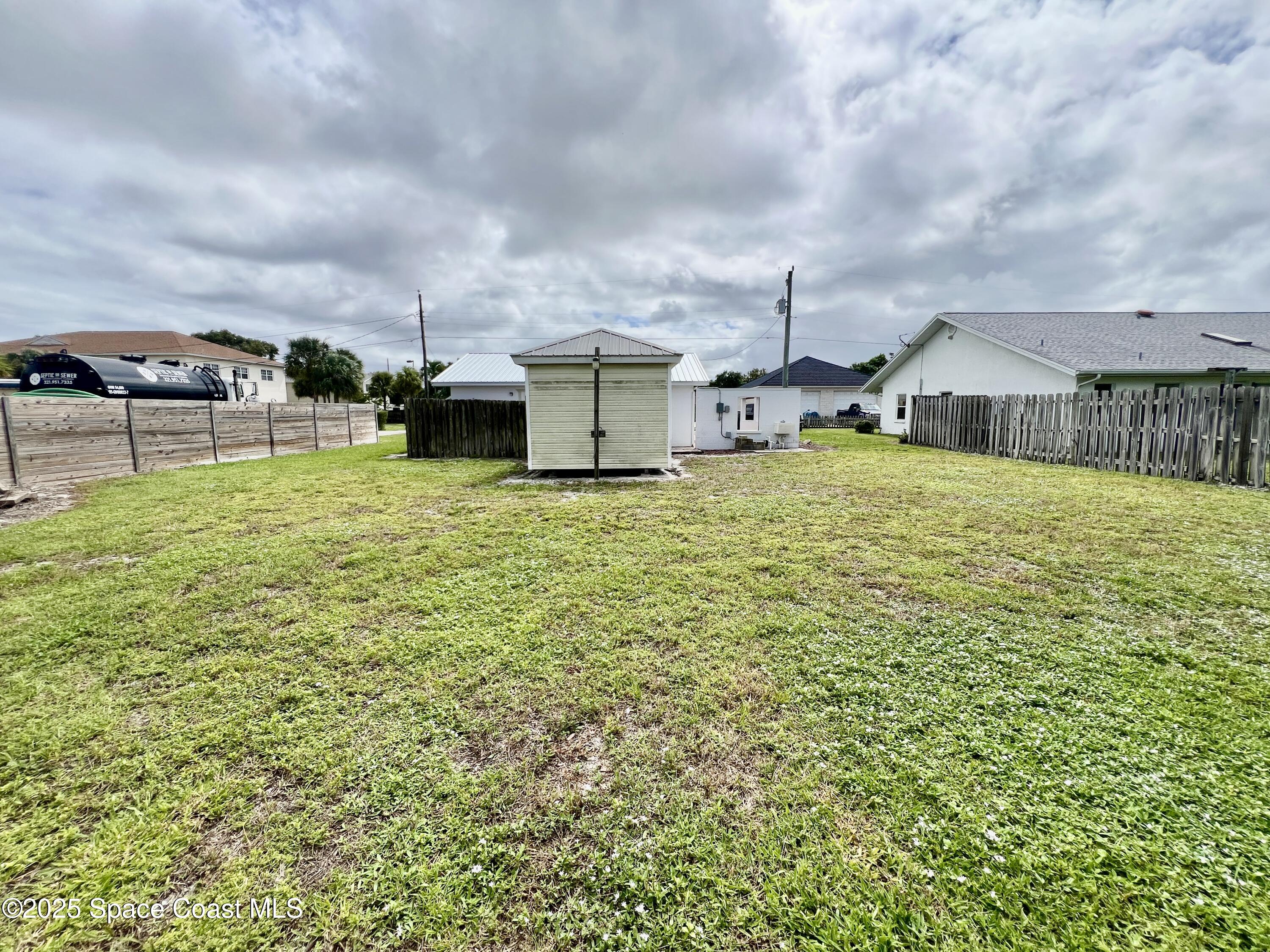 2767 Palm Drive Palm Bay, FL 32905 - Photo 19 of 26 a bathroom with a sink and a mirror