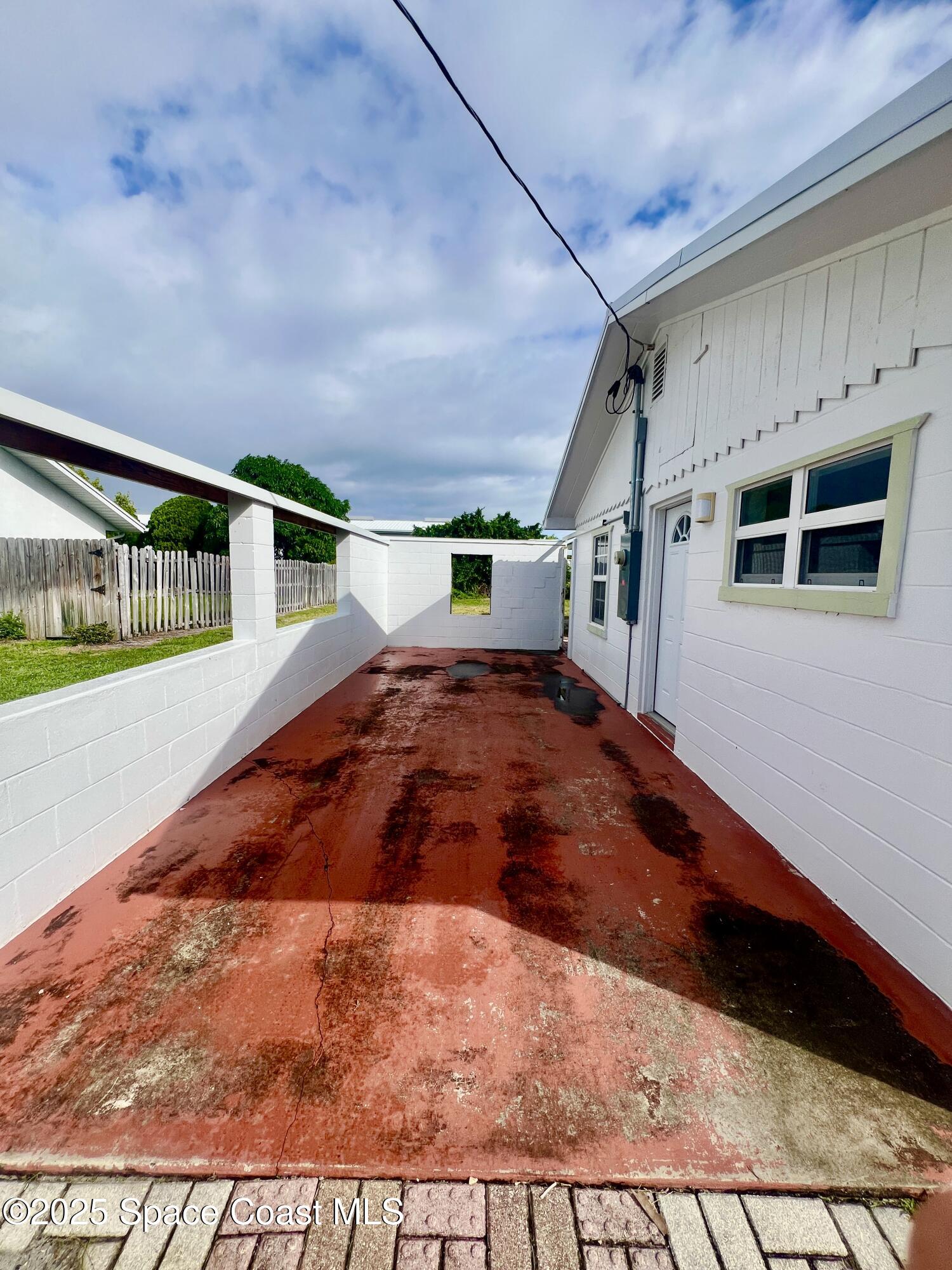 2767 Palm Drive Palm Bay, FL 32905 - Photo 22 of 26 a view of an empty room with a window