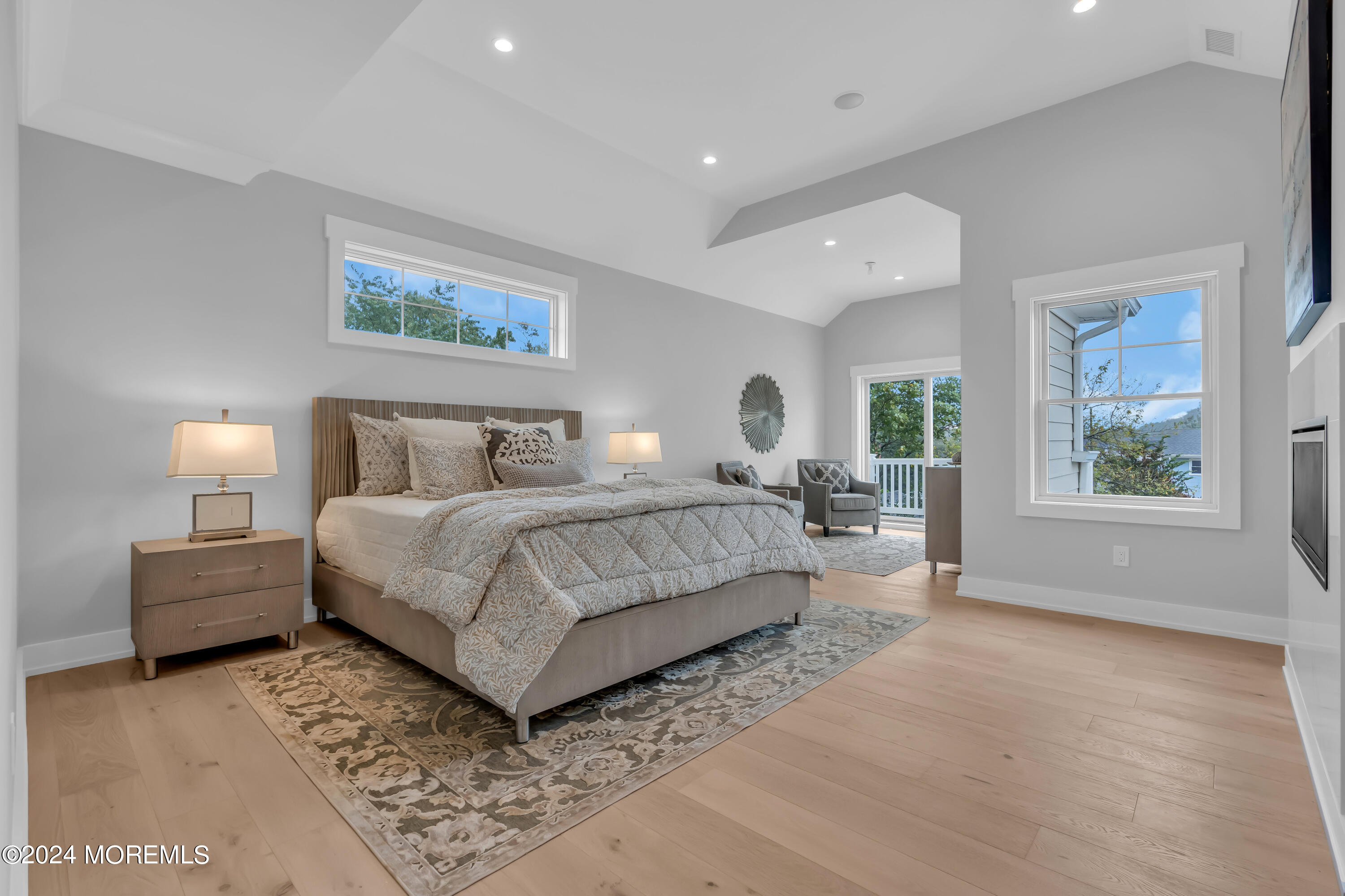 557 Ocean Road Spring Lake Heights, NJ 07762 - Photo 41 of 62 a bedroom with a large bed and a window
