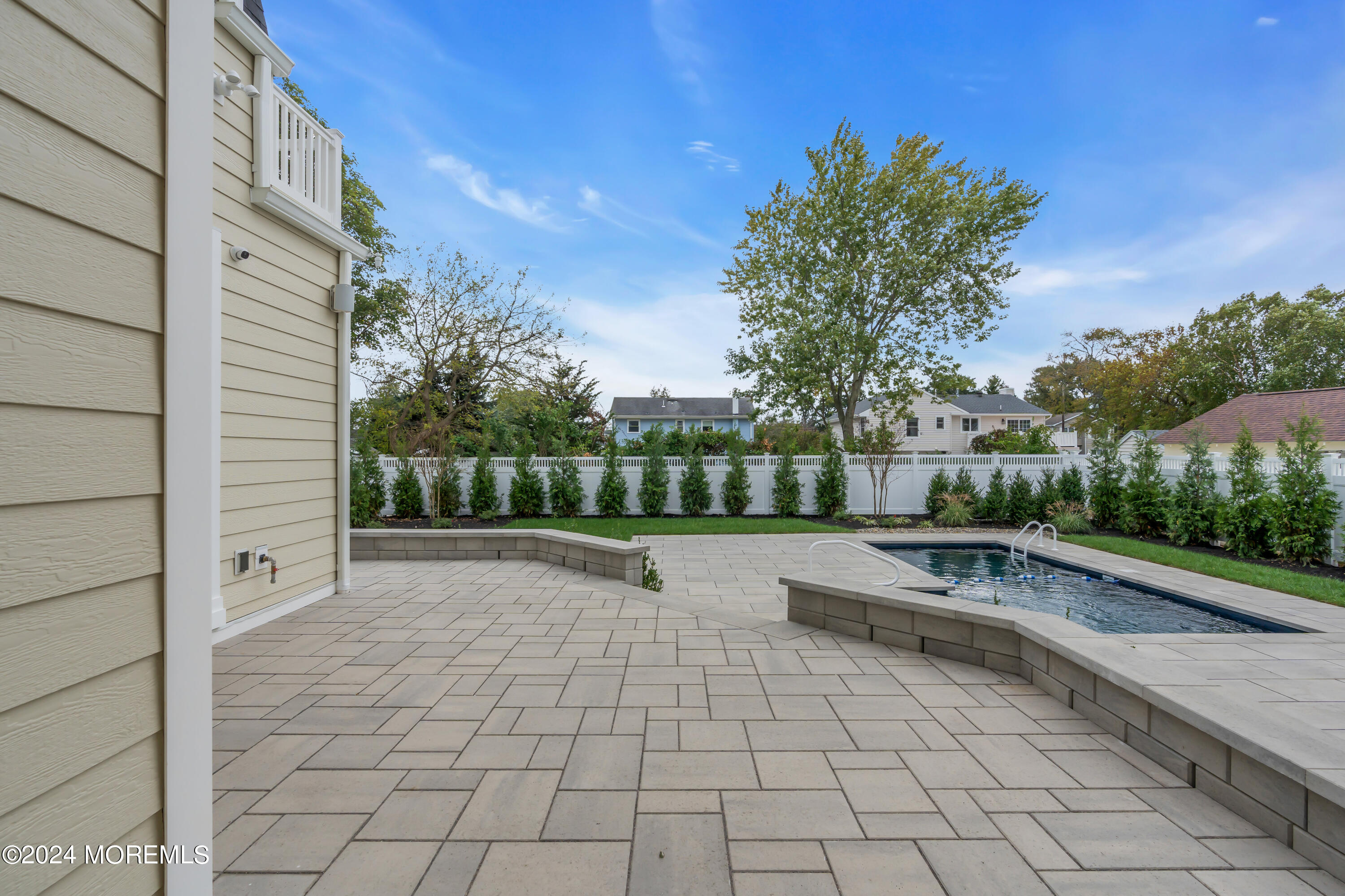557 Ocean Road Spring Lake Heights, NJ 07762 - Photo 57 of 62 a view of a yard with furniture and a fire pit