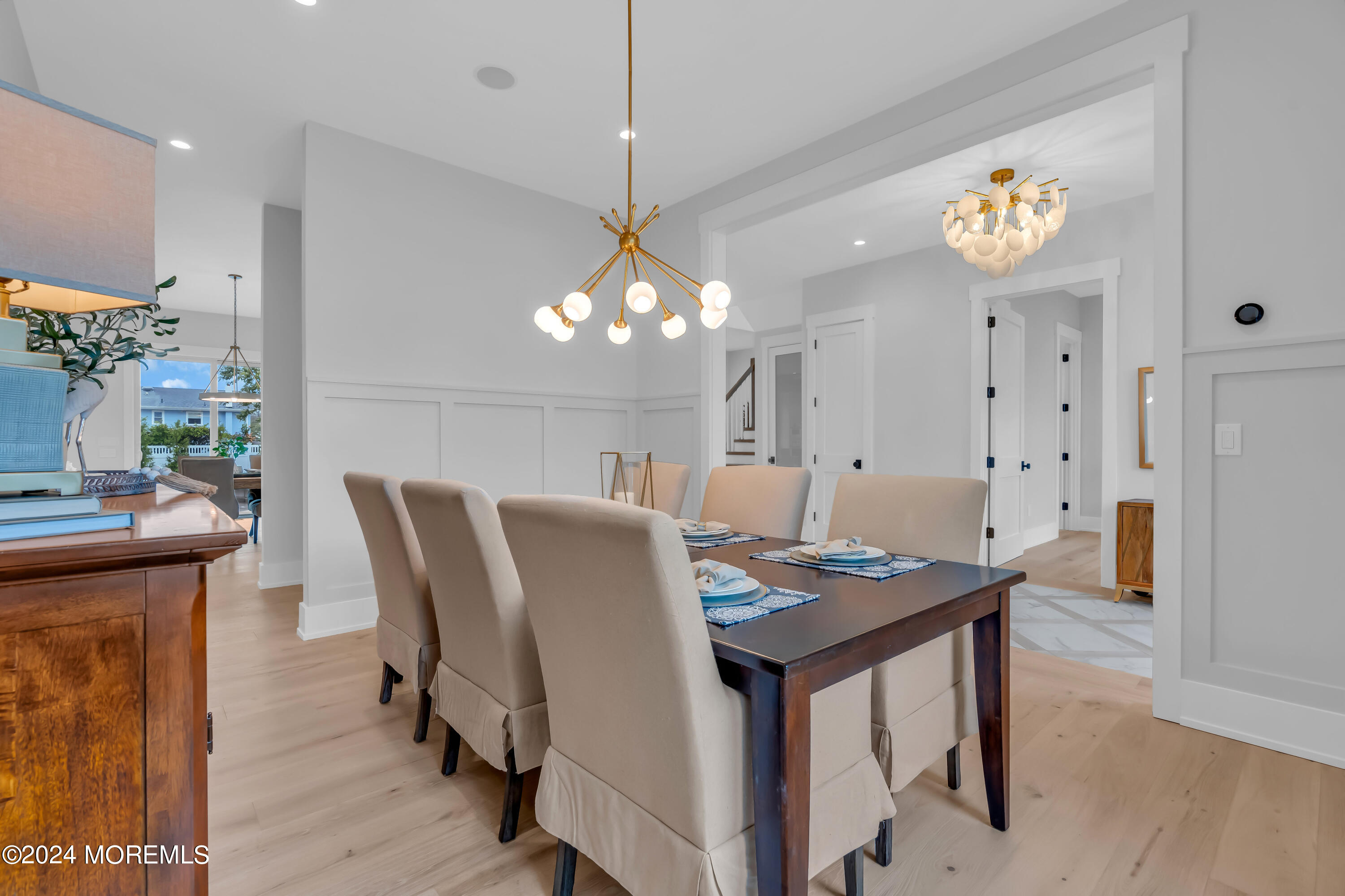 557 Ocean Road Spring Lake Heights, NJ 07762 - Photo 6 of 62 a view of a dining room with furniture and wooden floor