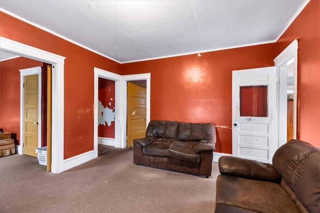 7 Liberty Street Mansfield, MA 02048 - Photo 14 of 42 a living room with furniture and a flat screen tv