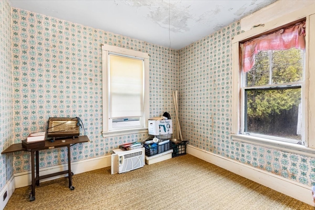 7 Liberty Street Mansfield, MA 02048 - Photo 19 of 42 a bedroom with furniture and a window