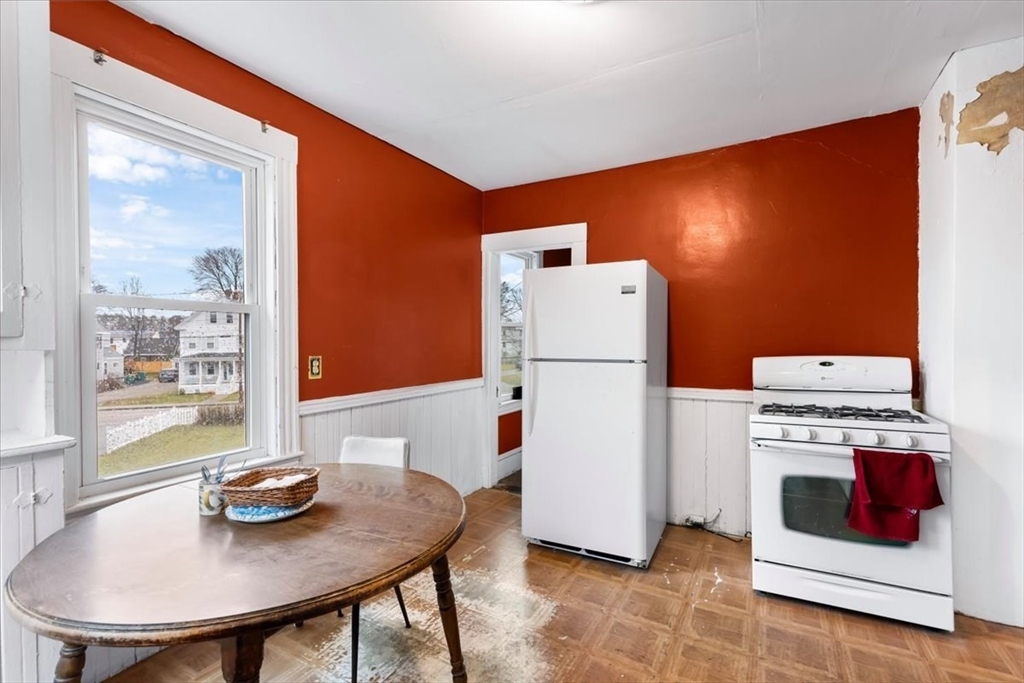 7 Liberty Street Mansfield, MA 02048 - Photo 2 of 42 a living room with furniture and a table